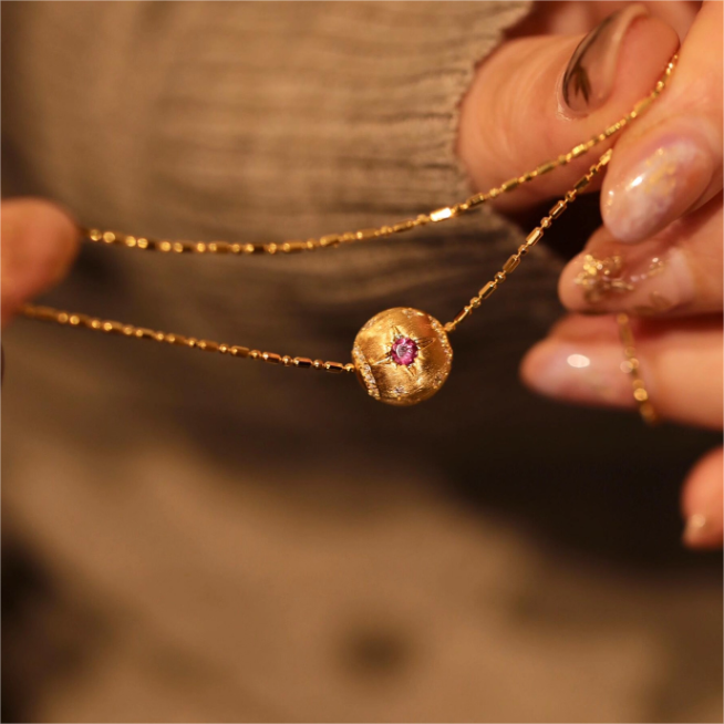 Gold Necklace with Blue Stone and Star Design