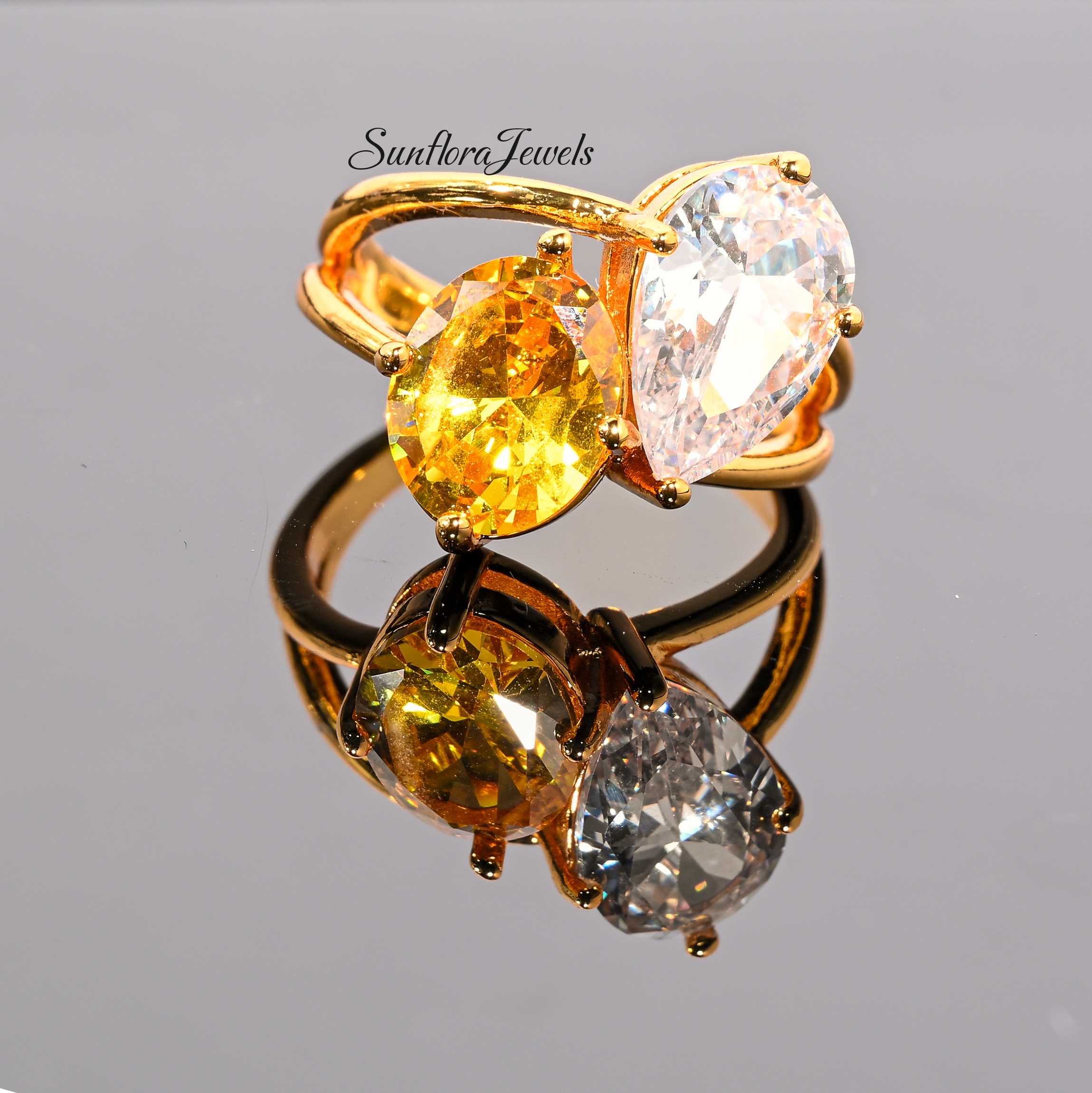 Elegant Two - Stone Diamond Ring: Yellow & White Pear Cuts in Gold