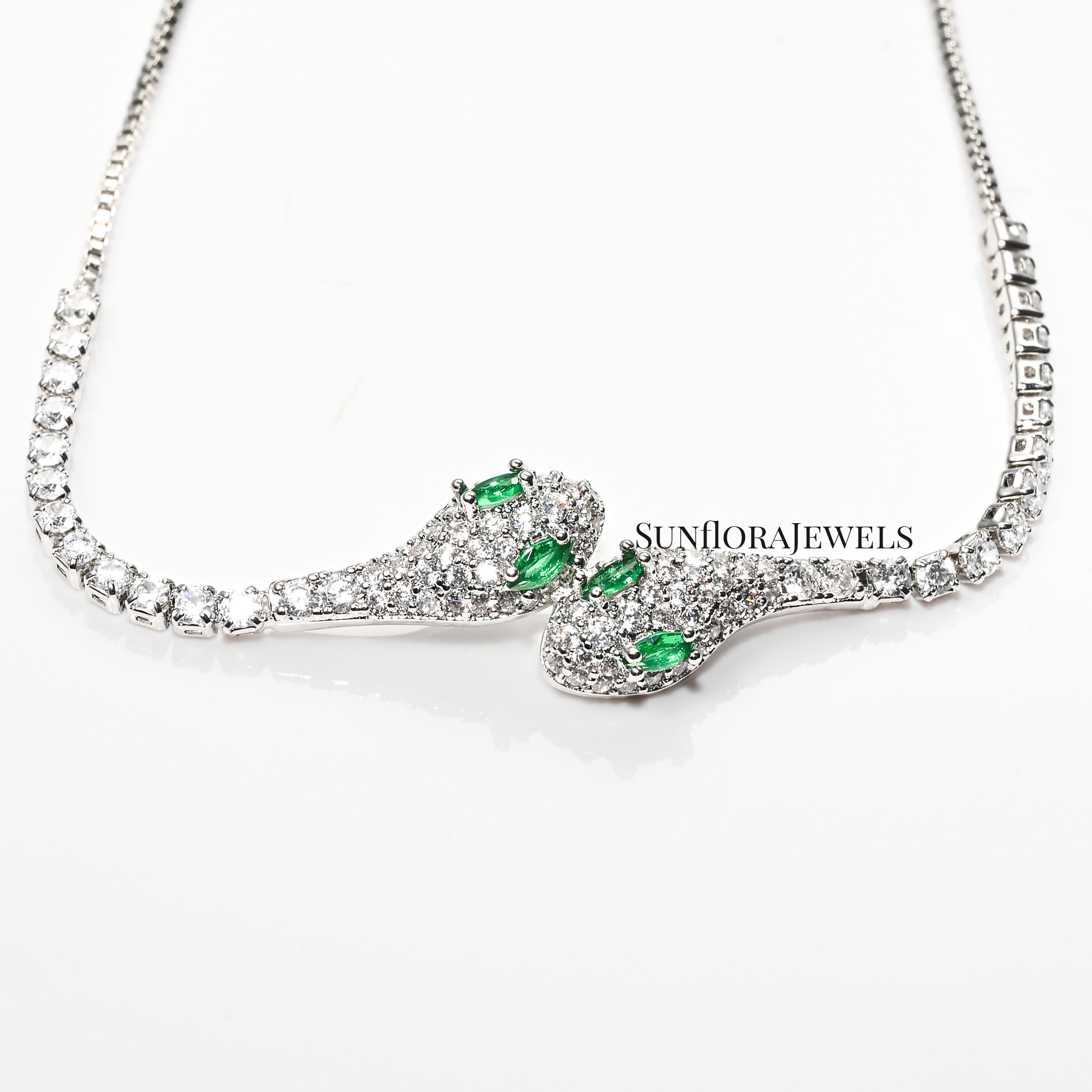 Adjustable Silver Snake Bracelet with Emerald Eye Details and Crystals