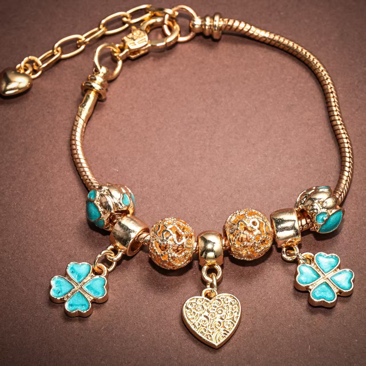 Gold Charm Bracelet with Turquoise Clover and Heart Pendants