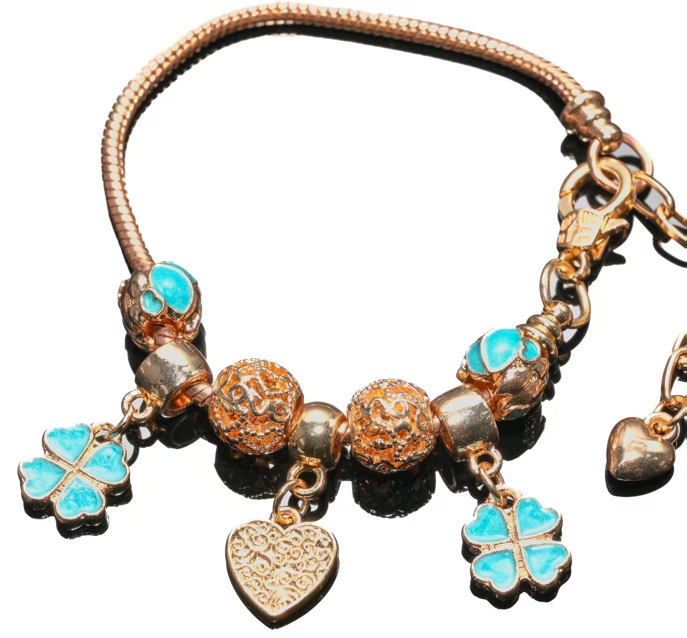 Elegant Gold Bracelet with Turquoise Clover and Intricate Heart Charms