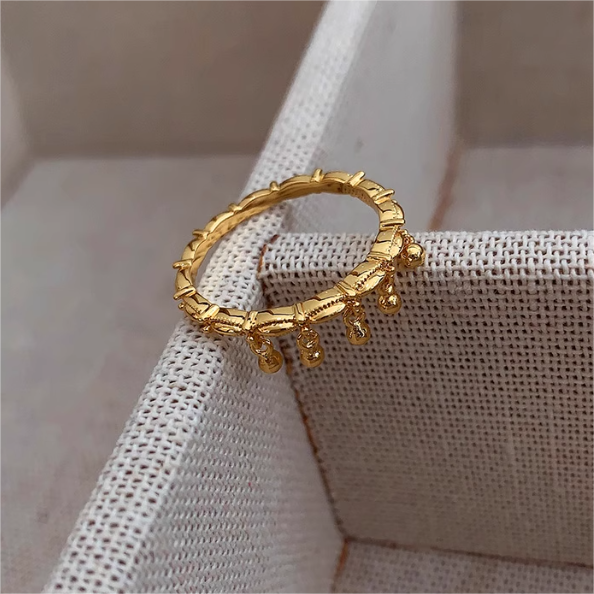 Delicate Gold Ring Featuring Hanging Beads