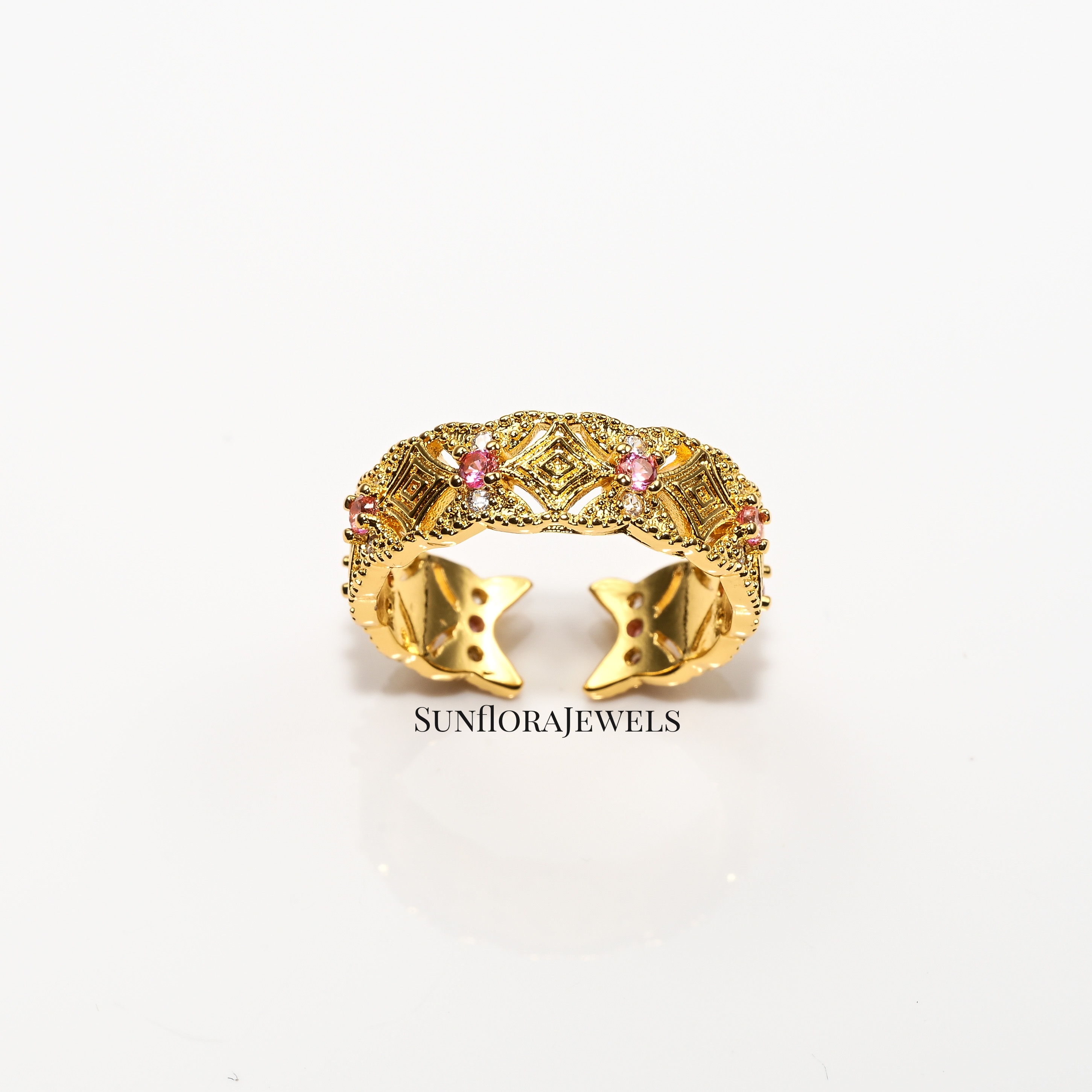 Art Deco Style Open Gold Ring Featuring Pink Crystals & Ornate Design